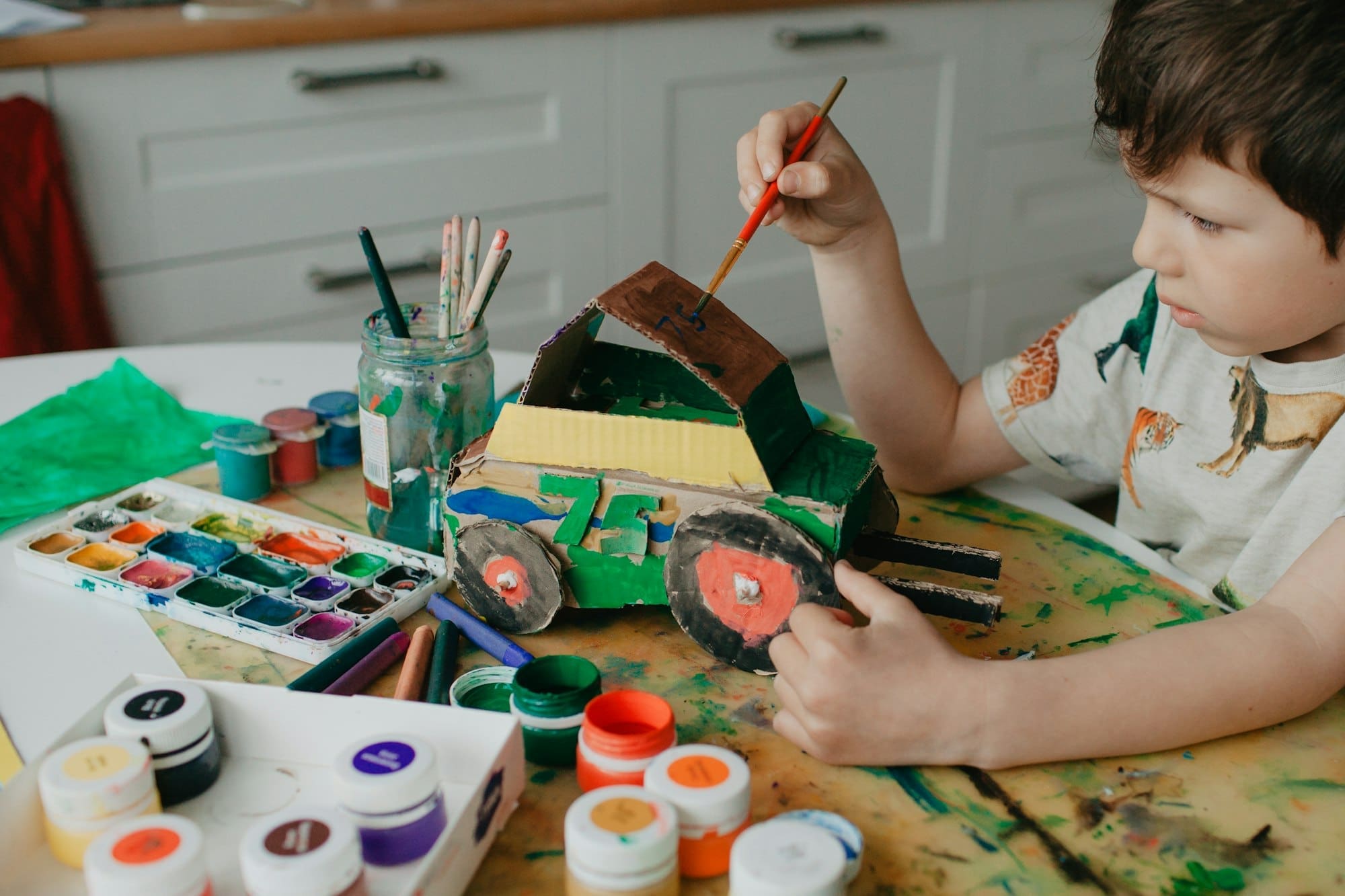 The craft made of cardboard by the hands of a child.